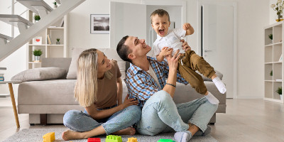 a young family sitting in their new home