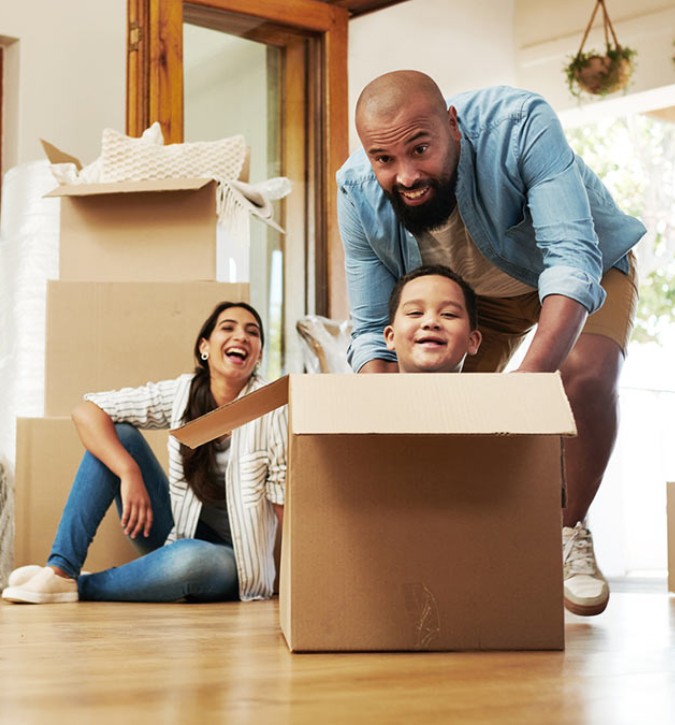 family playing in their new home