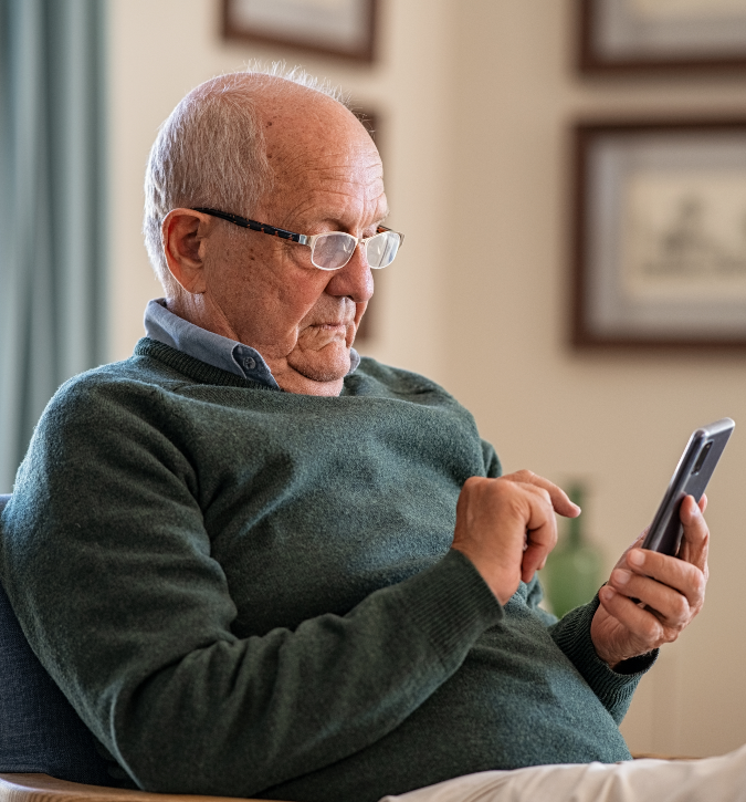 older gentleman using his smartphone
