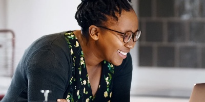 woman wearing glasses in her kitchen