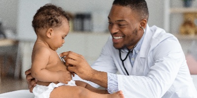 a doctor examining an infant