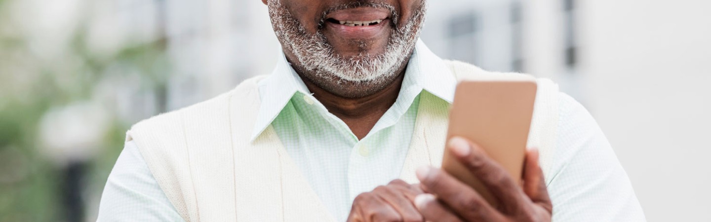 a man holding his mobile device