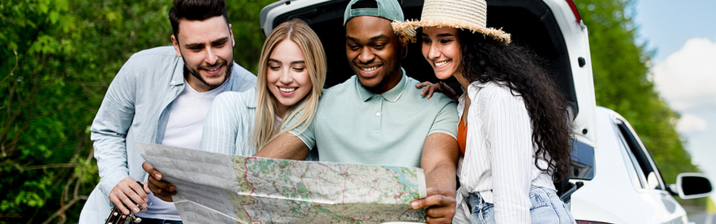 Group of young people looking a map