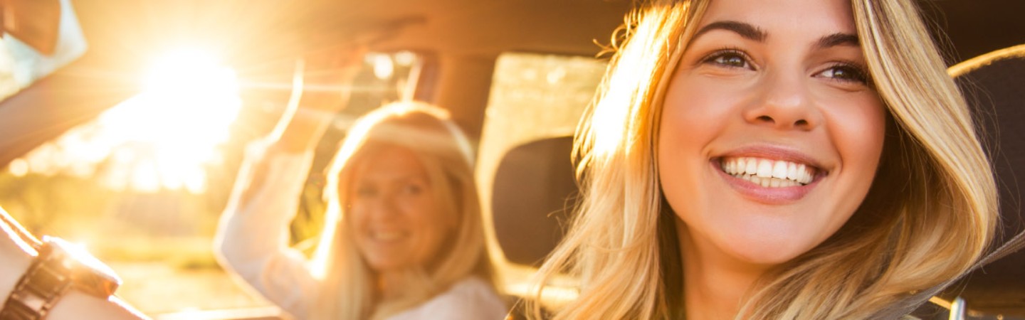 mother and daughter in a new car