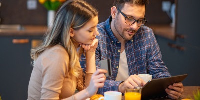 young couple viewing their tablet